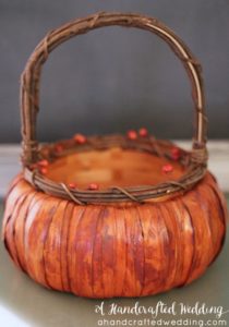 LOVE this idea for a fall wedding! Paint a pumpkin basket white, add twine and ribbon and use it for a flower girl basket. MountainModernLife.com