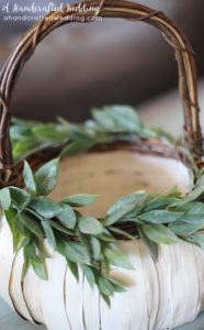 LOVE this idea for a fall wedding! Paint a pumpkin basket white, add twine and ribbon and use it for a flower girl basket. MountainModernLife.com