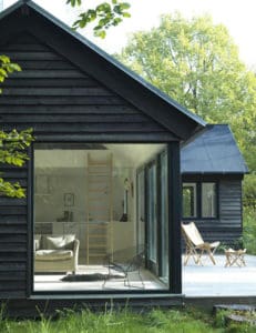 Looking for exterior home inspiration? Check out these 15 Modern Rustic Homes with Black Exteriors! MountainModernLife.com