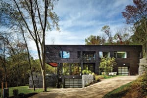 Looking for exterior home inspiration? Check out these 15 Modern Rustic Homes with Black Exteriors! MountainModernLife.com