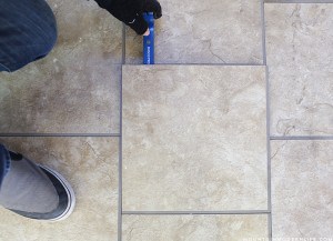 removing old tile in RV with mini crowbar