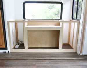 custom built in media cabinet with tv lift and electric fireplace mountainmodernlife.com