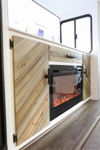 electric-fireplace-installed-inside-motorhome-with-tv-lift-mechanism-mountainmodernlife.com