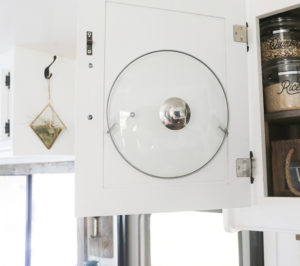 Put lid hanging on cabinet in RV