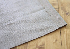 Looking for ways to add warmth and texture to your home or RV? See how easy it is to make burlap roller shades! MountainModernLife.com