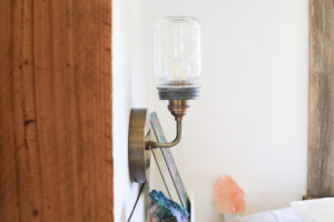 DIY Mason Jar Light Fixture - See how easy it is to create this wall sconce with a dimmer switch, perfect for adding a rustic touch to your home or RV! MountainModernLife.com