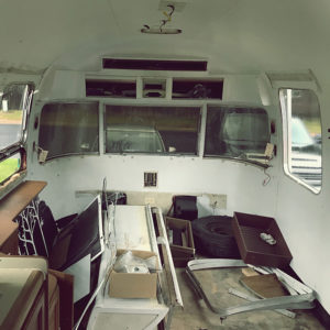 Tour this Renovated Airstream from Trailer Trashin' with Modern Finishes and Tropical Vibes! Featured on MountainModernLife.com