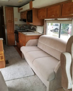 Tour this modern yet cozy renovated RV filled with lots of white, shiplap, and warm wood tones from @WilsonGrandAdventures! Featured on MountainModernLife.com