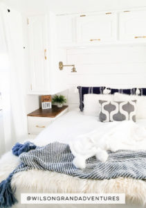 Tour this remodeled RV filled with lots of white, shiplap, and warm wood tones from @WilsonGrandAdventures! Featured on MountainModernLife.com
