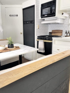Tour this budget-friendly farmhouse camper that was transformed for $500 by Proverbs31Girl! Featured on MountainModernLife.com