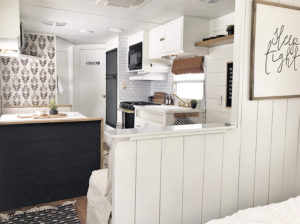 Tour this budget-friendly farmhouse camper that was transformed for $500 by Proverbs31Girl! Featured on MountainModernLife.com