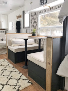 Tour this budget-friendly farmhouse camper that was transformed for $500 by Proverbs31Girl! Featured on MountainModernLife.com