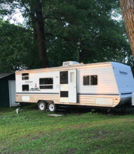 Tour this budget-friendly farmhouse camper that was transformed for $500 by Proverbs31Girl! Featured on MountainModernLife.com
