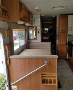 Tour this modern yet cozy renovated RV filled with lots of white, shiplap, and warm wood tones from @WilsonGrandAdventures! Featured on MountainModernLife.com