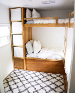 Tour this kid-friendly modern rustic camper created by a husband and wife design team, @Joinery&DesignCo! Featured on MountainModernLife.com #camperreno #campermakeover #camperremodel #tinyhometour #modernrustic
