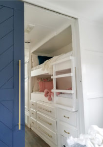Tour this remodeled RV filled with lots of white, shiplap, and warm wood tones from @WilsonGrandAdventures! Featured on MountainModernLife.com