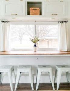 Tour this modern yet cozy renovated RV filled with lots of white, shiplap, and warm wood tones from @WilsonGrandAdventures! Featured on MountainModernLife.com