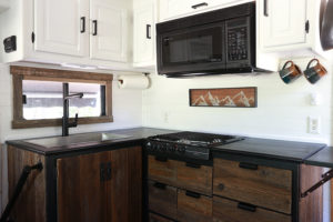 Considering adding black kitchen countertops to your home? Come see how we updated butcher block countertops for a rustic modern vibe in our RV. MountainModernLife.com