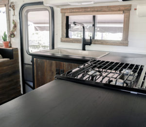 Considering adding black kitchen countertops to your home? Come see how we updated butcher block countertops for a rustic modern vibe in our RV. MountainModernLife.com