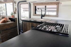 Considering adding black kitchen countertops to your home? Come see how we updated butcher block countertops for a rustic modern vibe in our RV. MountainModernLife.com