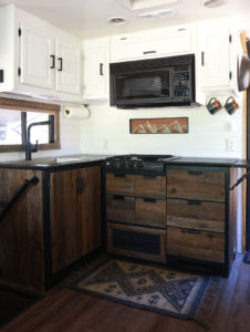 Considering adding black kitchen countertops to your home? Come see how we updated butcher block countertops for a rustic modern vibe in our RV. MountainModernLife.com