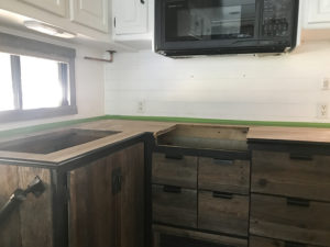 Considering adding black kitchen countertops to your home? Come see how we updated butcher block countertops for a rustic modern vibe in our RV. MountainModernLife.com