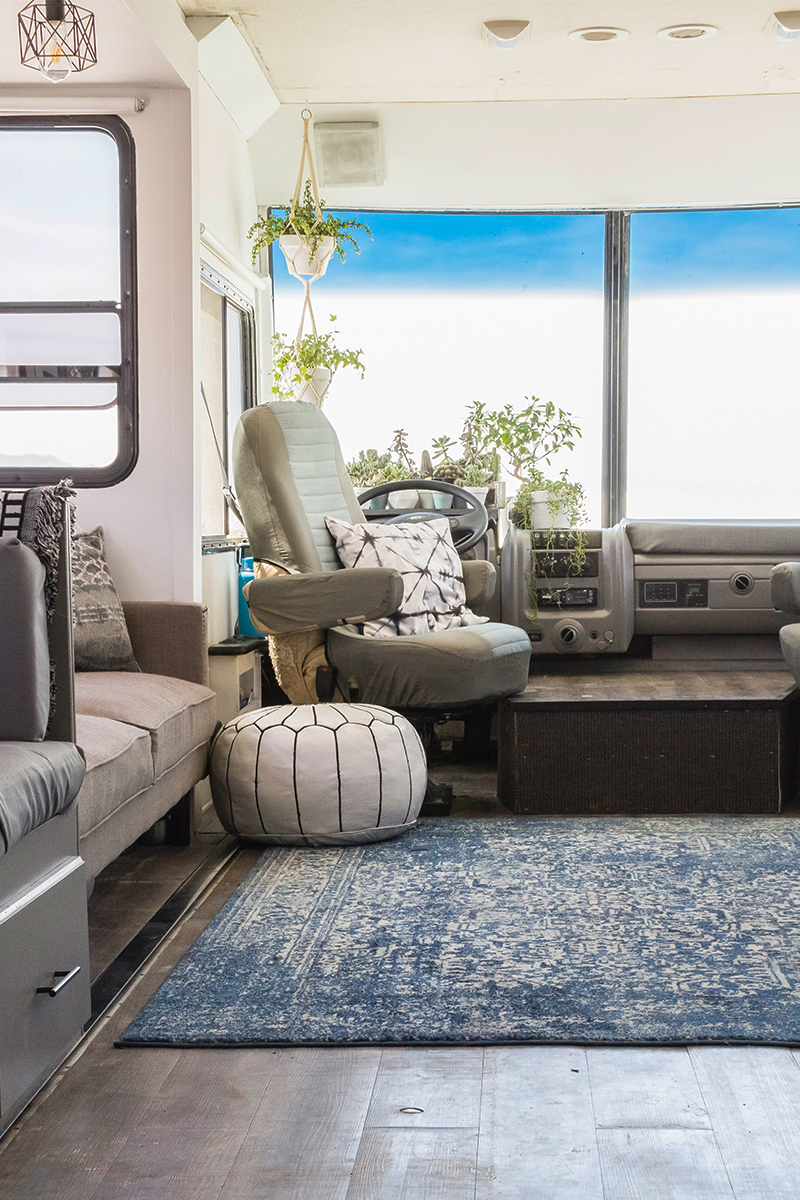 This RV has been transformed into an off-grid tiny home on wheels (and it's for sale!) Photos from @LifeAmongPines - view the tour on MountainModernLife.com
