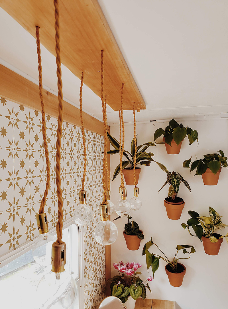 The interior of this bohemian 5th wheel is a botanical wonderland! Featuring @leeannieblivin on mountainmodernlife.com