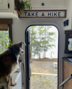 Take a hike sign above door in RV