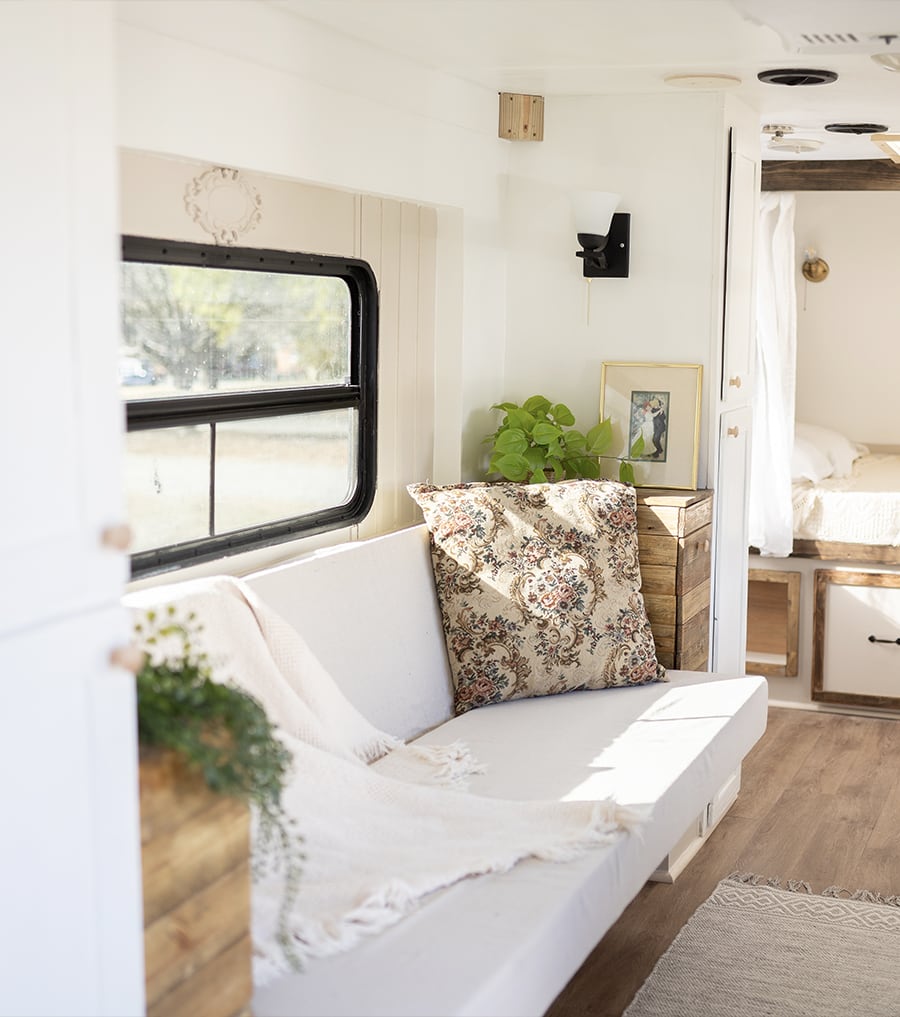 This vintage-country camper renovation has the coziest bed nook