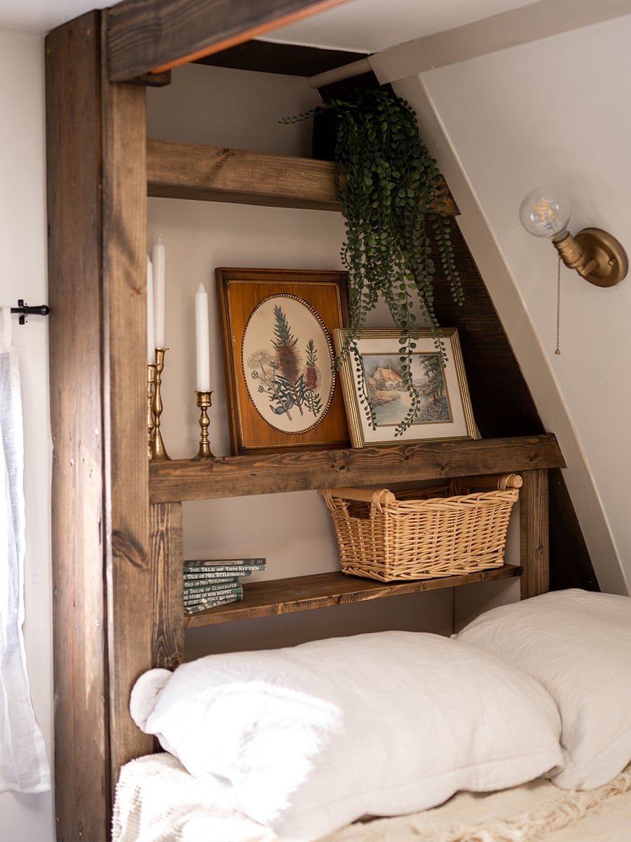 This vintage-country camper renovation has the coziest bed nook