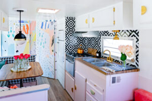 vintage camper with pink kitchen cabinets