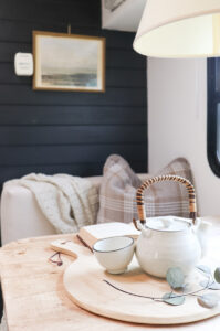 camper dinette makeover with plaid pillow
