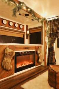 RV decorated for Christmas as night
