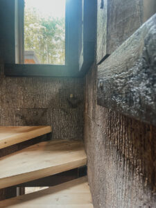 rustic bark accent wall in mountain home