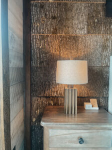 rustic bark accent wall in mountain home bedroom