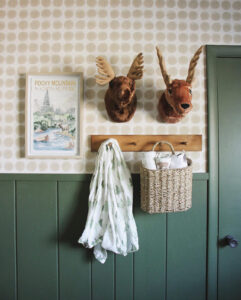 nursery with outdoorsy charm and green accentwall