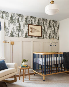 gender-neutral nursery with tree wallpaper